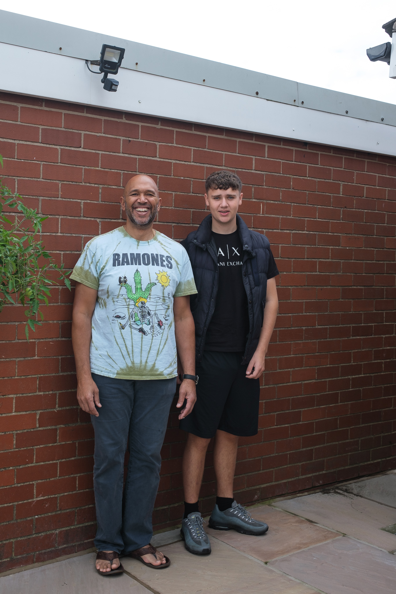 Two men standing side by side